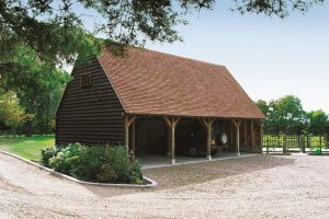 Beautiful timber garage with staddle stones on each post base