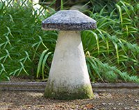 Traditional mushroom staddle stone in the Chilstone show garden