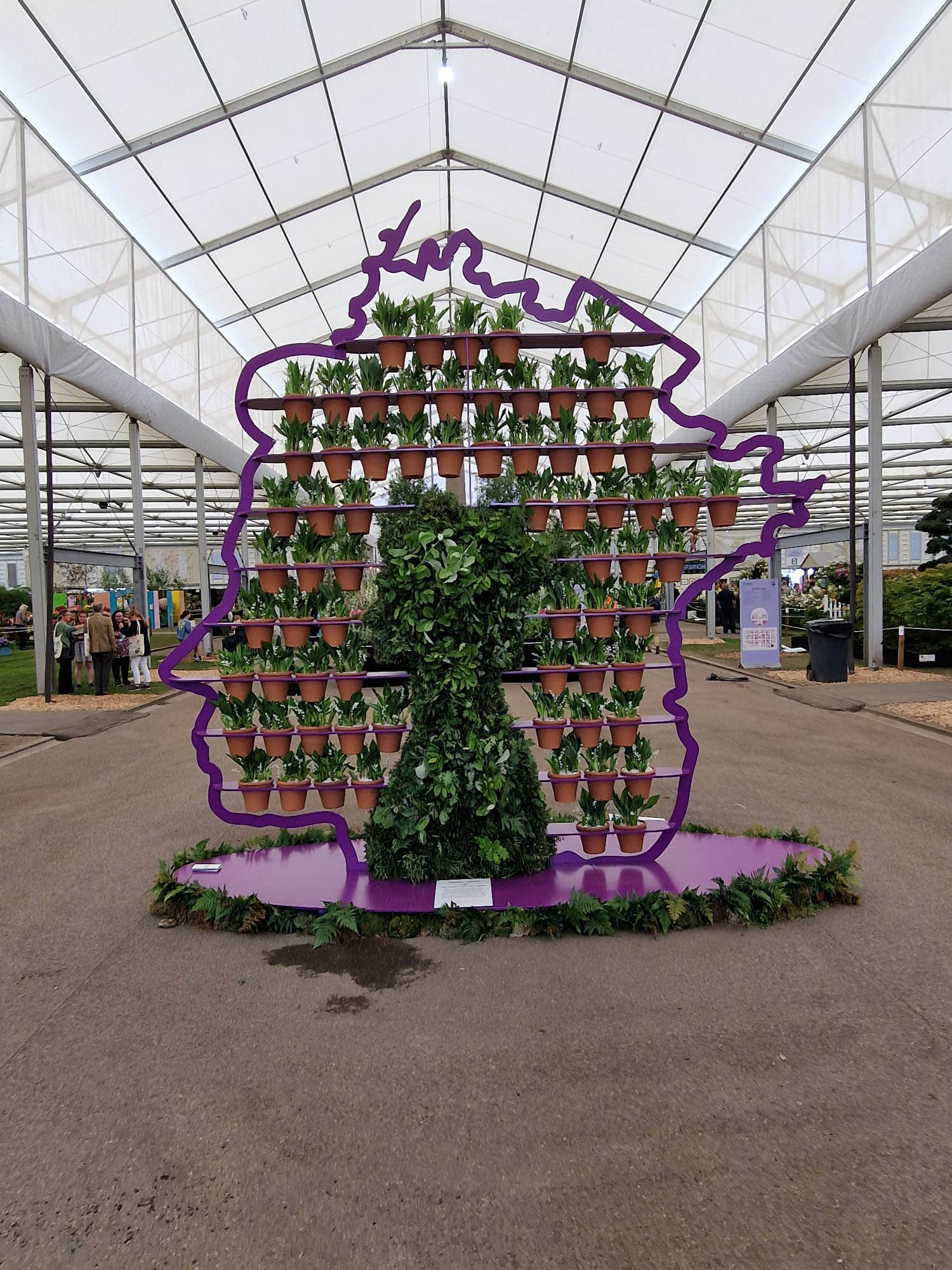 Amazing 3D silhouette portrait of the Queen made from foliage and 70 pots of HRM favourite flower Lilly of the valley representing 70 years on the thrown as part of the jubilee celebrations in the gardens by Simon Lycett designer