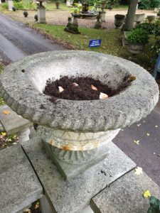 Bulbs being planted in a small Chilstone urn. 
