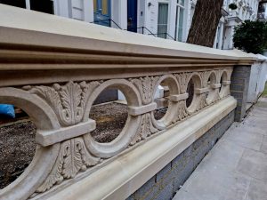 Balustrading restored by Chilstone in a style unique to this Kensington street in a circular pattern with acanthus leaf pattern.